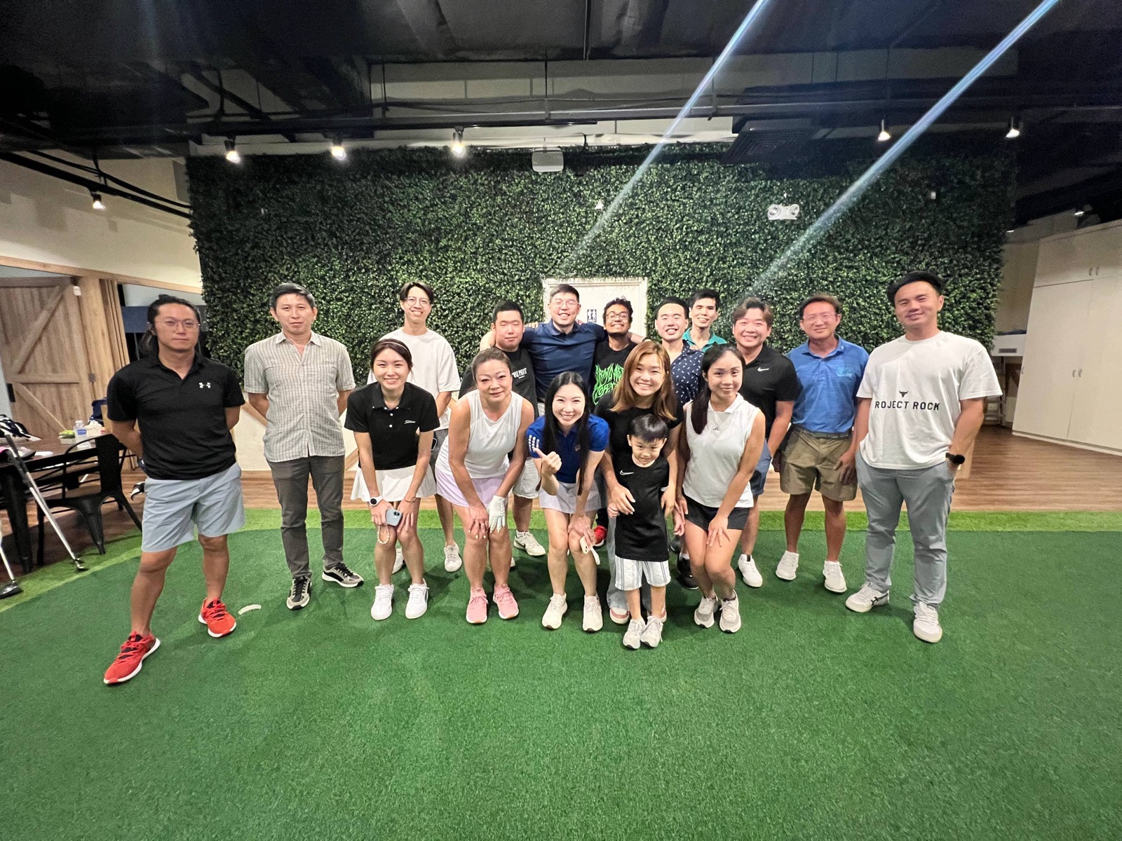 Indoor golf simulator night with the whole crew
