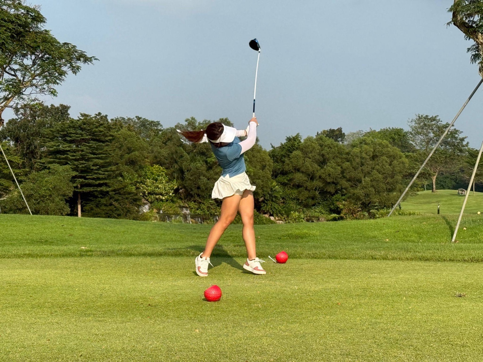 Driver off the tee, caught at the top of the swing